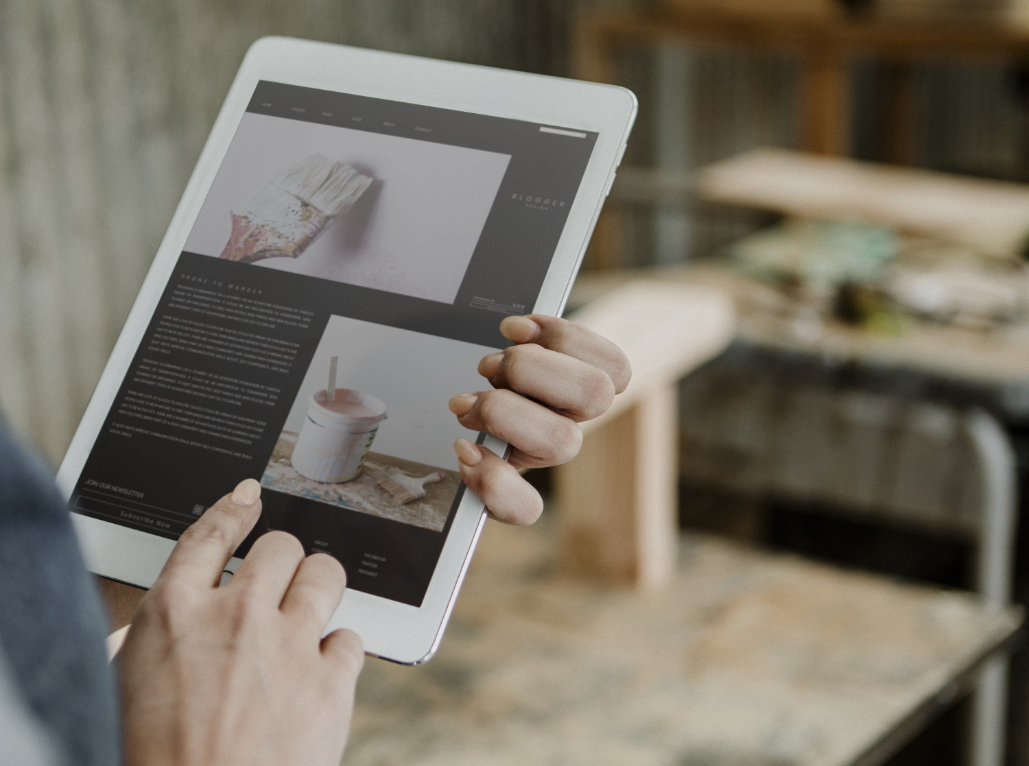 BSPOKE Design - Photo of a carpenter holding a tablet and blogging as a marketing tool for his business